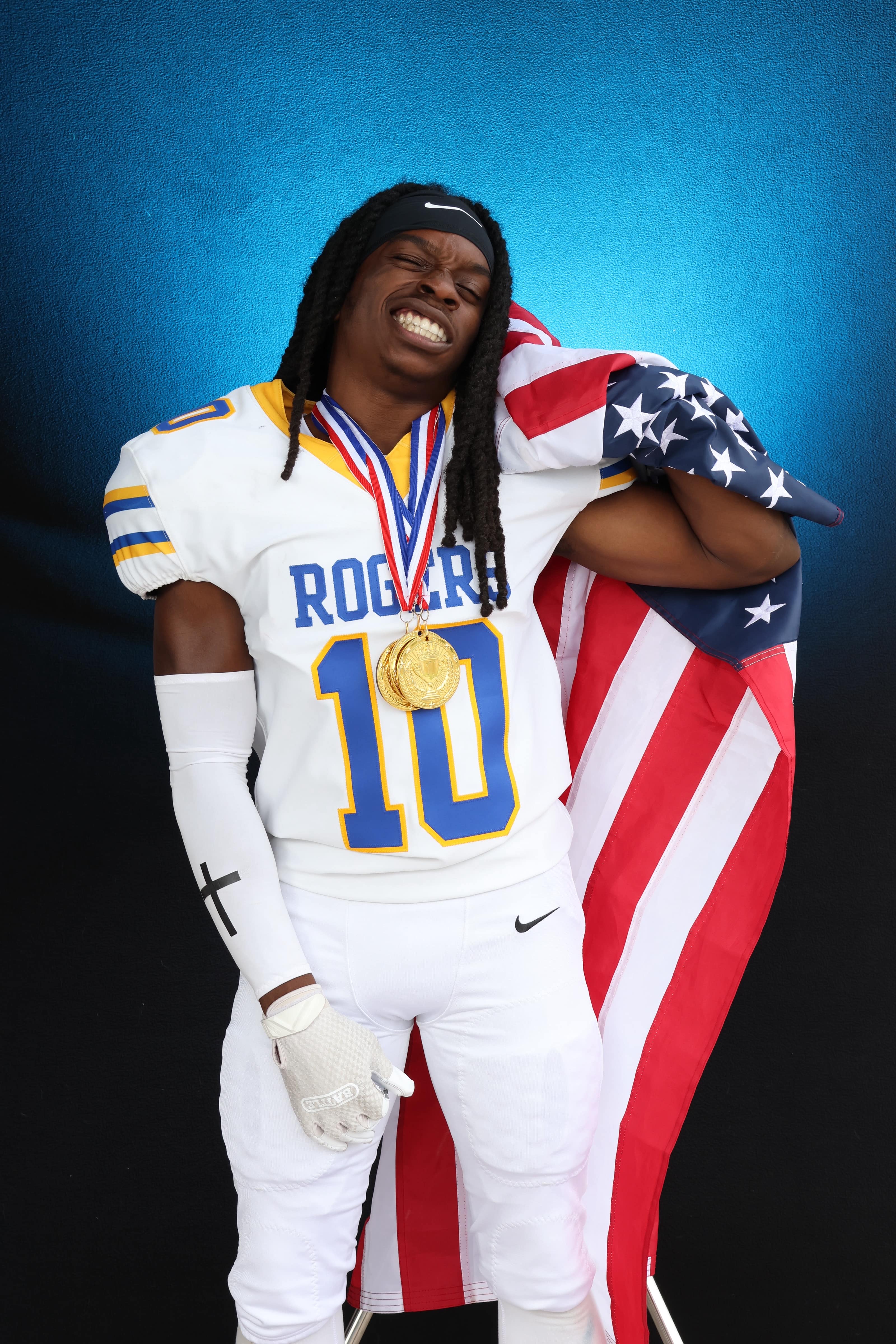 Football-player-metals-flag