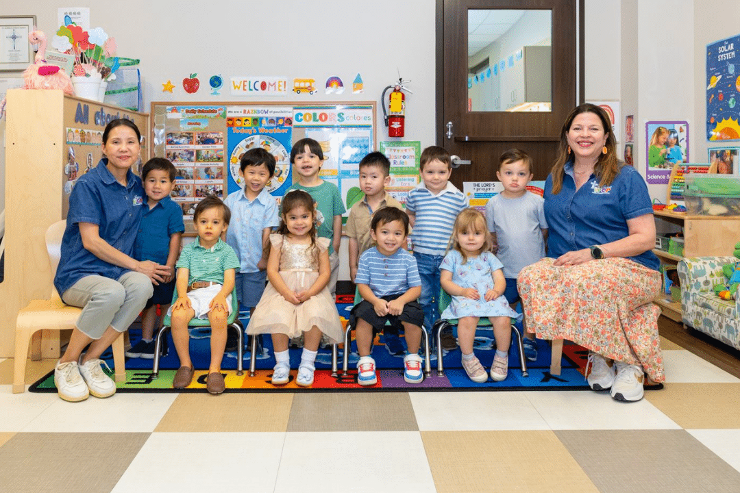Group of small children at a daycare center with their teachers.
